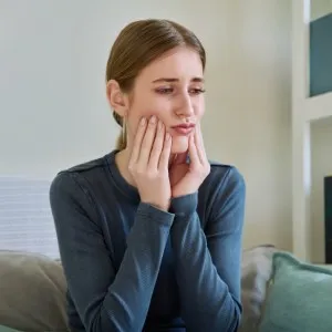 Woman suffering jaw pain